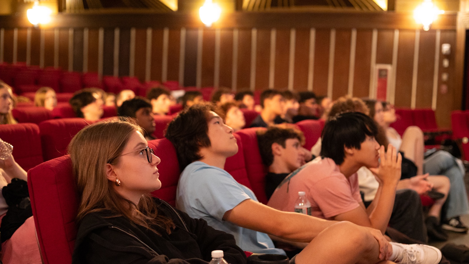 Students sitting at the Coolidge Corner Theatre